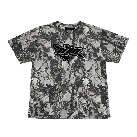 Heavyweight 100% cotton oversized tee featuring an all-over grey woodland camo print and black NTA front graphic. Made with 250 GSM cotton and a drop-shoulder fit.